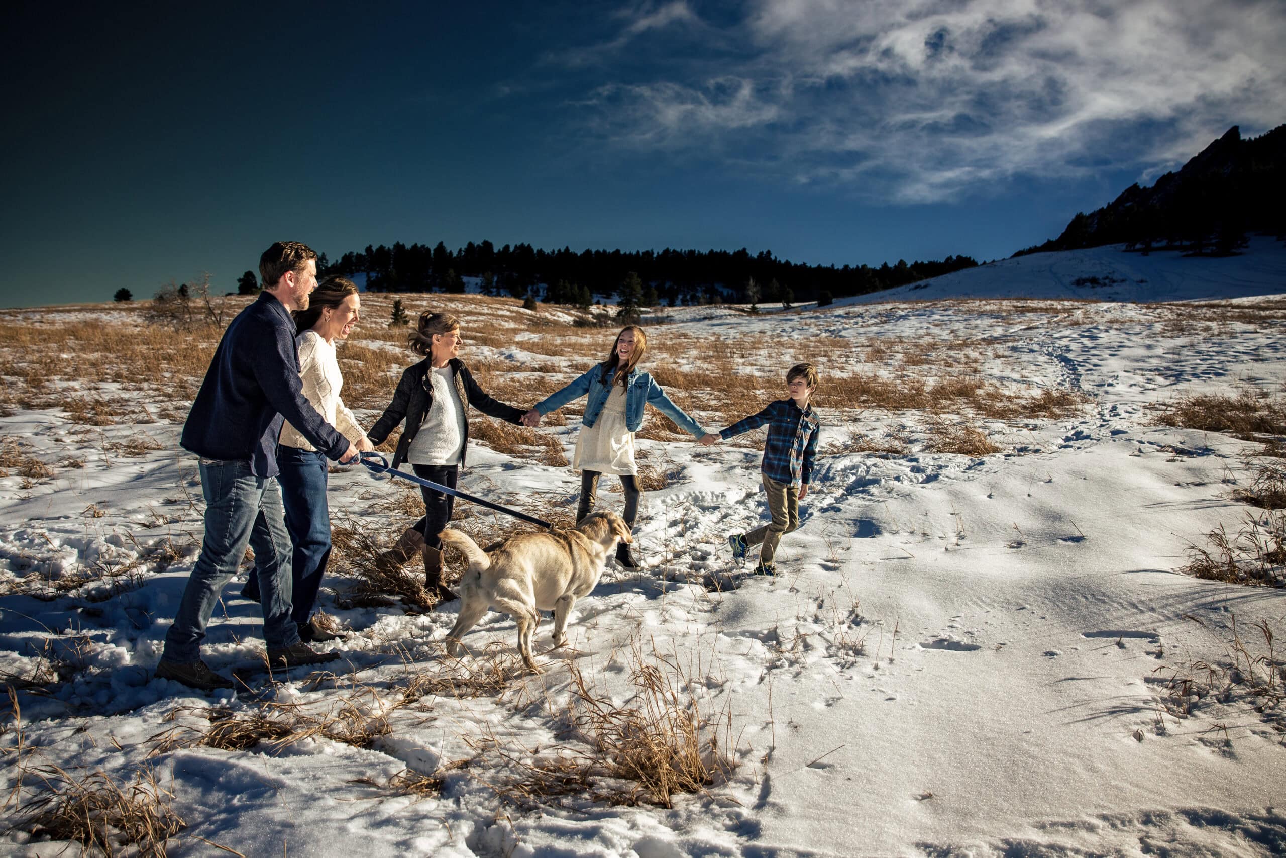 A family of five go for a hike near the Colorado Chautauqua in Boulder A portrait of a family of four at the flatirons in Boulder Colorado during their lifestyle family photography session.