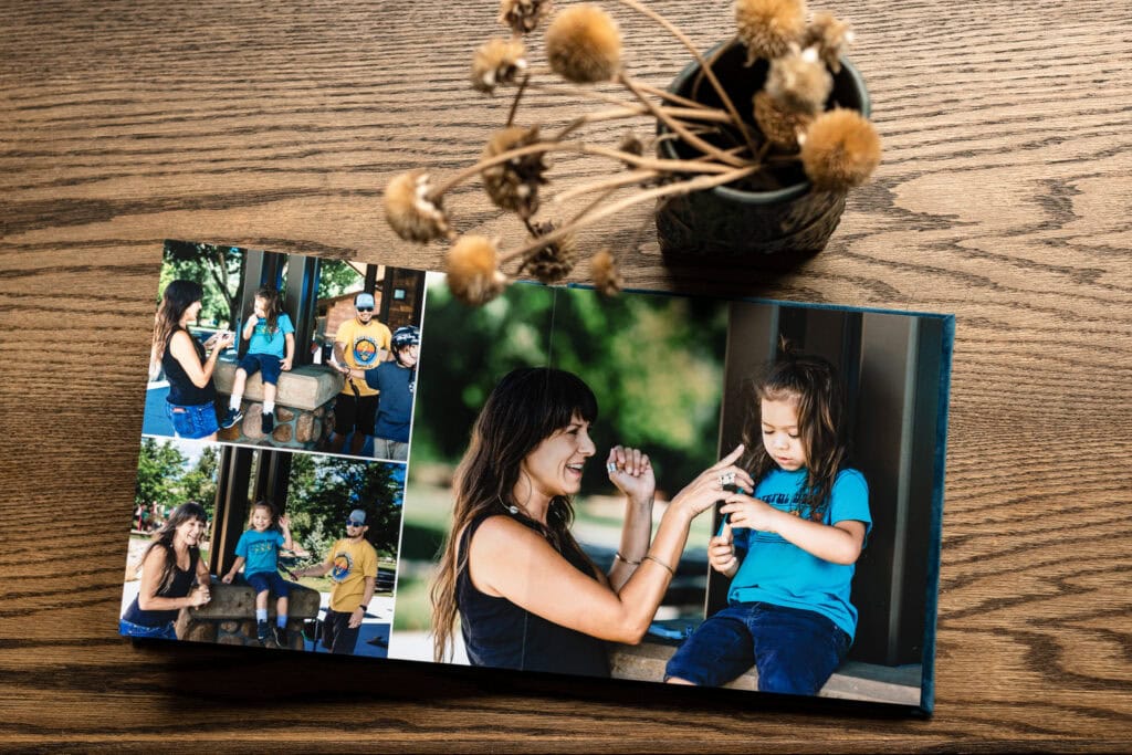 Photography Services photo book with tender mother-daughter portraits on a wooden table