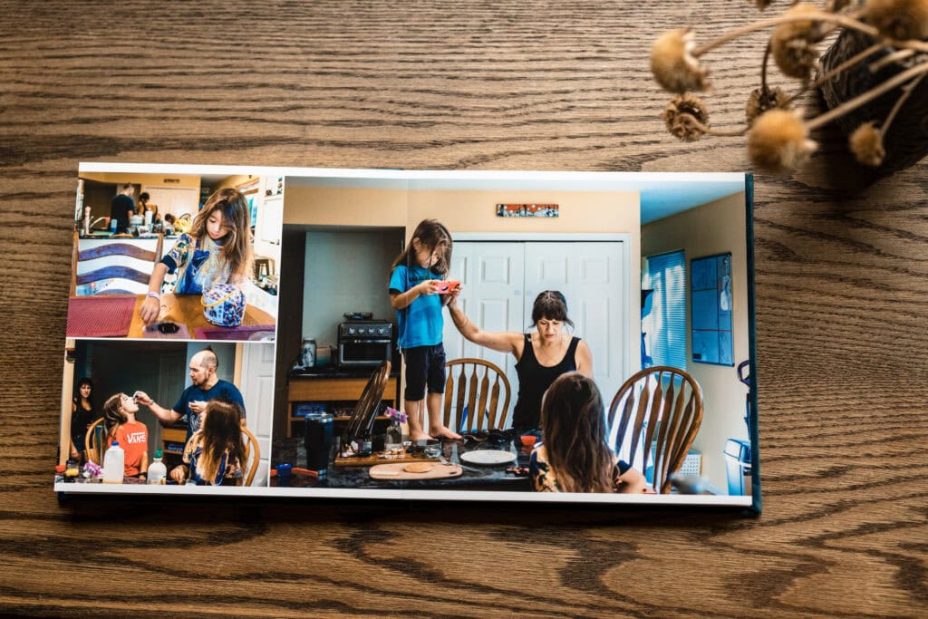 Photography Services photo book of candid family memories on a wooden table