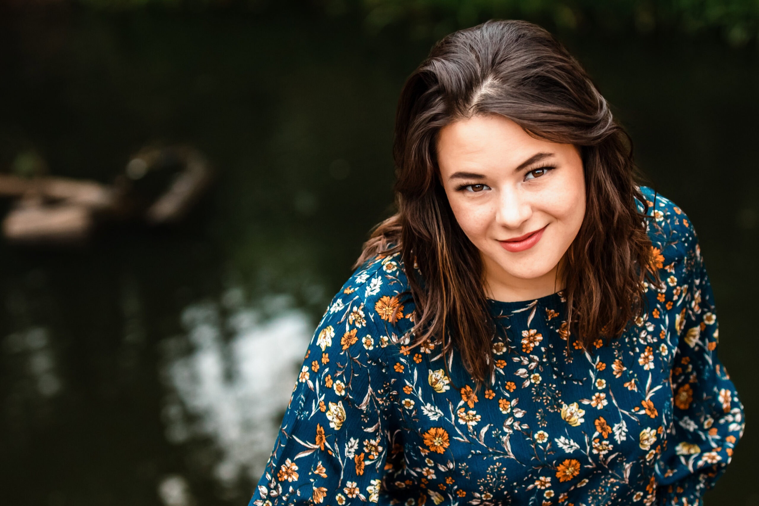 Senior student portrait by the water in Colorado