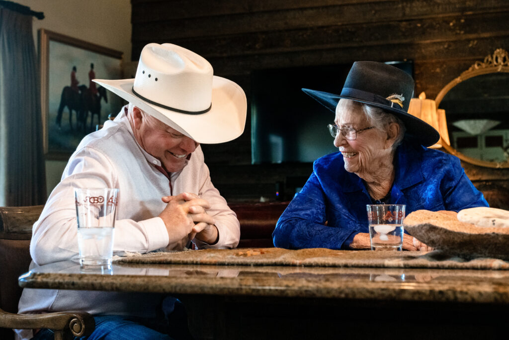 Elderly woman smiling while preserving her family legacy in a filmed storytelling session in Colorado