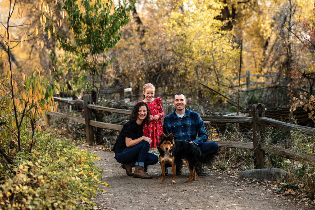 Colorado fall family mini session with parents, child, and dog on autumn trail