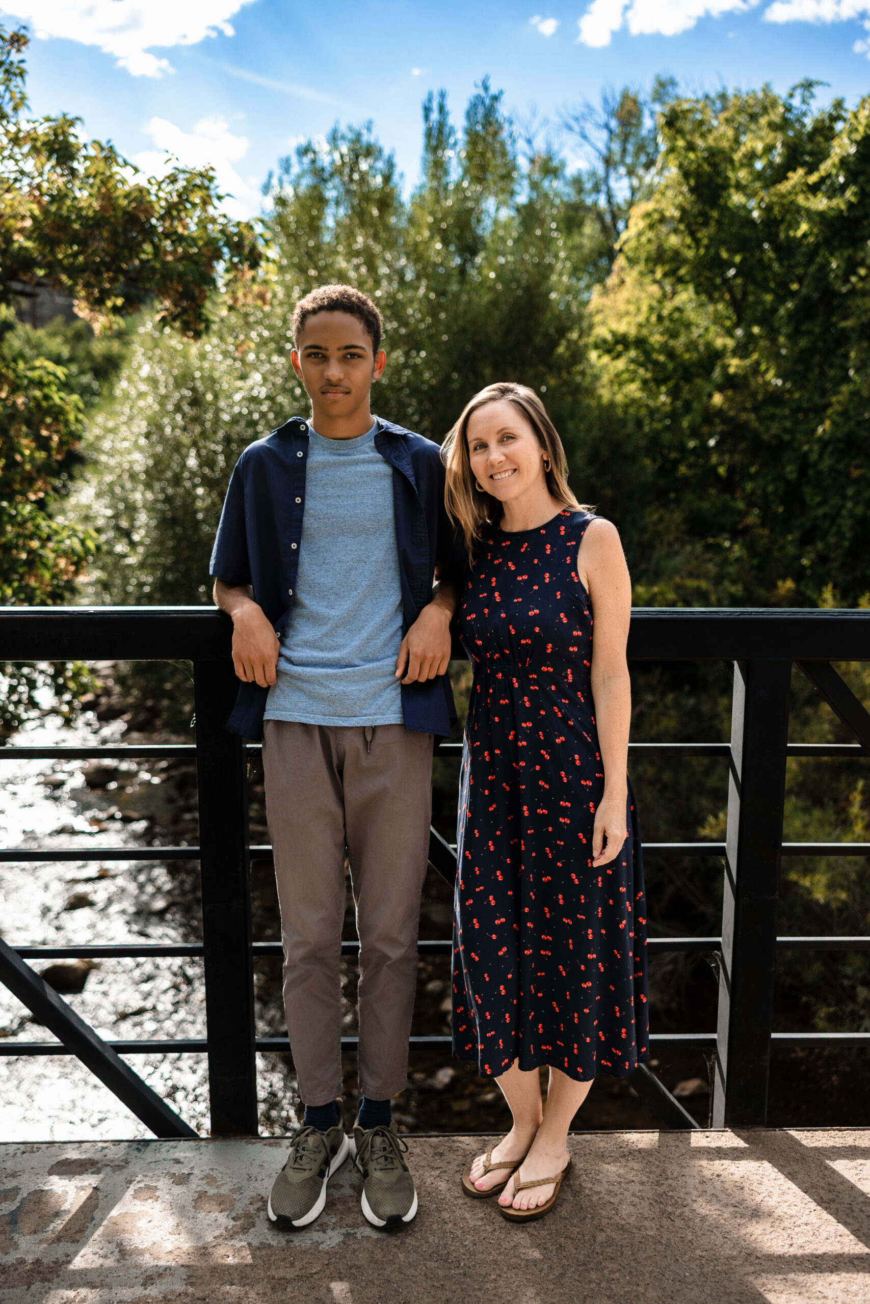 Candid moment of senior with his mom during relaxed Boulder senior portrait session